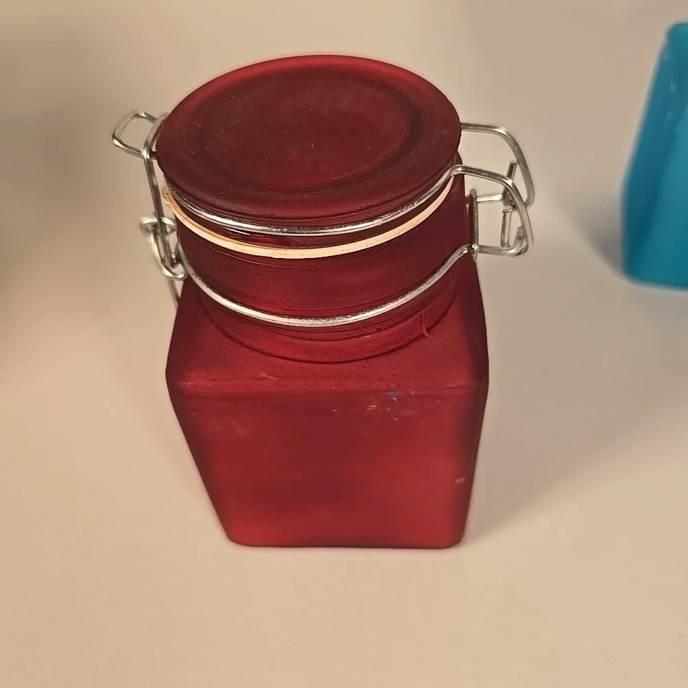 Set Of Four Colored‎ Glass Cannisters With Locking Tops Very Good Condition